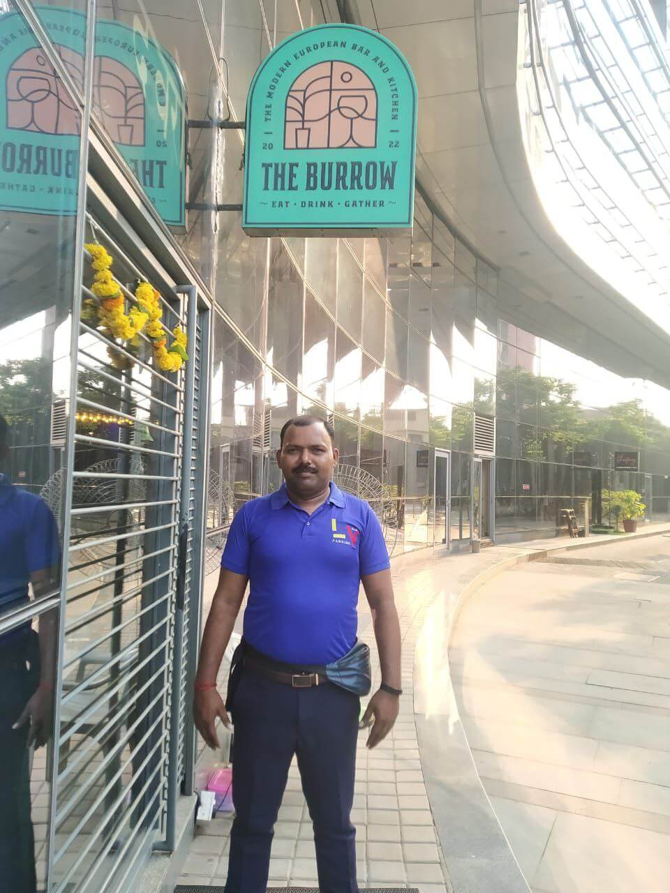 Traffic marshals managing vehicle movement outside a busy venue
